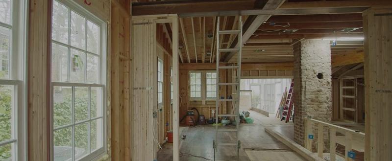 Before: the same space during construction with exposed wood framing